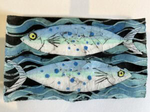 Abstract painting of two fish with blue spots.