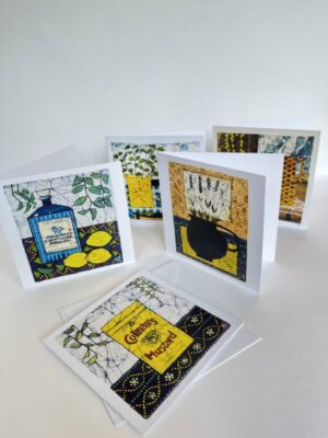 Colourful artistic greeting cards on display.